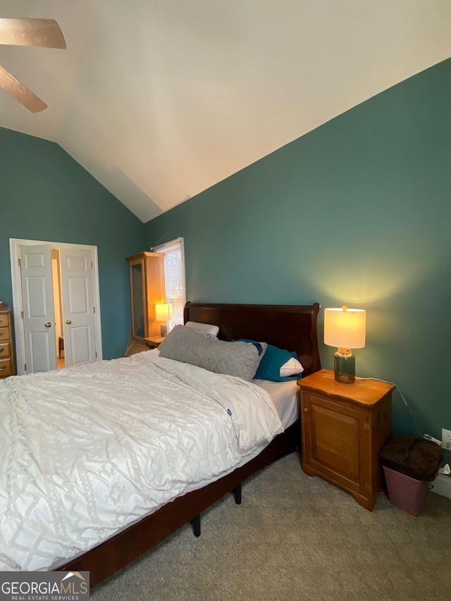 carpeted bedroom with lofted ceiling and ceiling fan