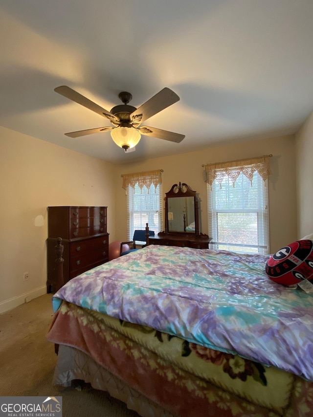 bedroom featuring ceiling fan and carpet flooring