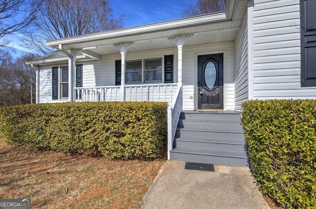 property entrance featuring covered porch