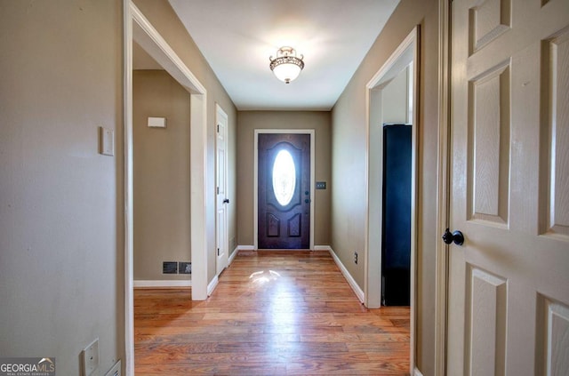 doorway to outside with light hardwood / wood-style floors