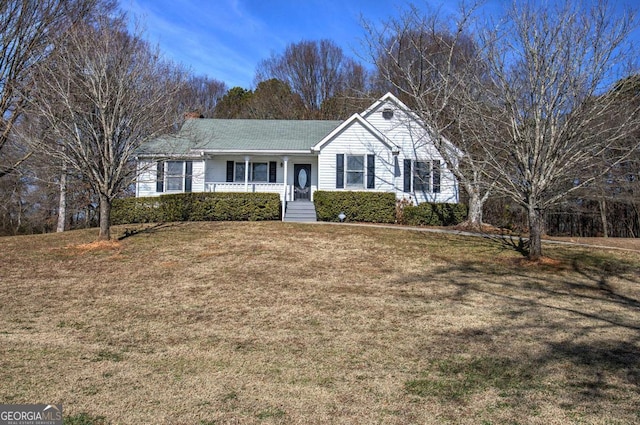 ranch-style house with a porch and a front yard