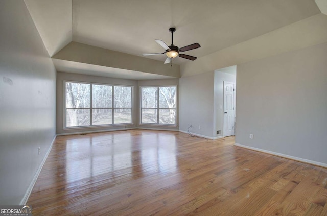 unfurnished room featuring light wood-type flooring, ceiling fan, and lofted ceiling