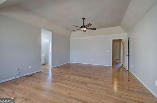 unfurnished room with ceiling fan, lofted ceiling, and light hardwood / wood-style flooring