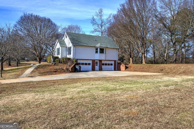 view of side of home with a garage and a lawn