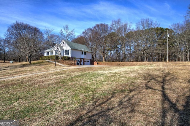 view of yard with a garage