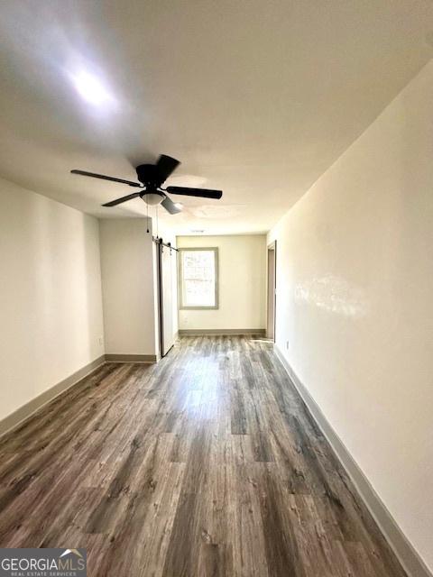 unfurnished room featuring dark hardwood / wood-style floors