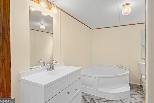 bathroom featuring toilet, vanity, and a bathing tub