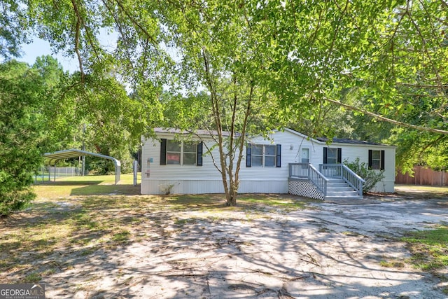 manufactured / mobile home with a carport