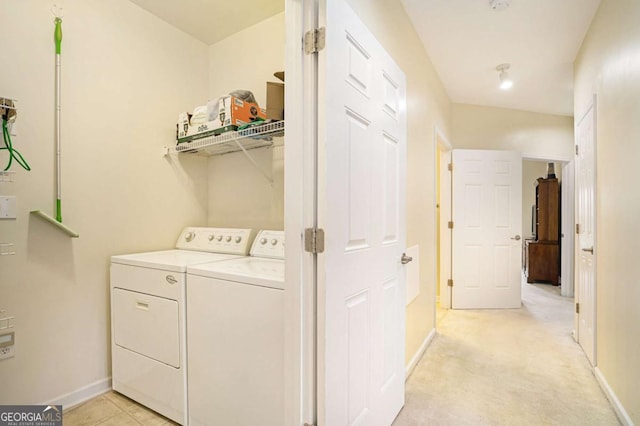 washroom featuring light colored carpet and washing machine and clothes dryer