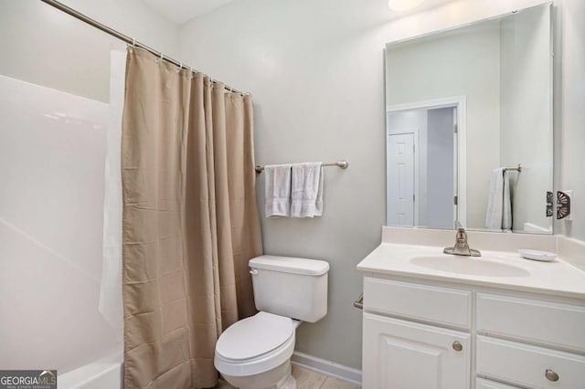 full bathroom featuring toilet, vanity, and shower / bath combo with shower curtain