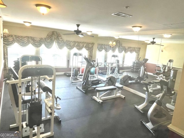 exercise room with ceiling fan with notable chandelier