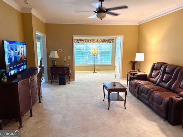 living room with ceiling fan, crown molding, and light carpet