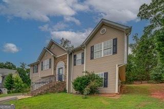 bi-level home with a front yard