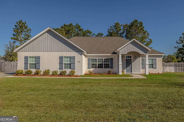 ranch-style house featuring a front lawn