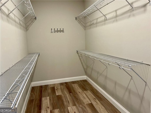 kitchen with stainless steel dishwasher, plenty of natural light, cream cabinetry, and sink