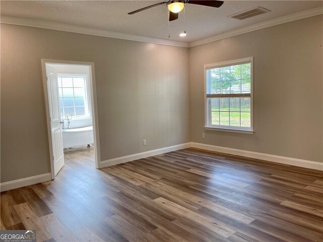 living room featuring a textured ceiling, ceiling fan, ornamental molding, and light hardwood / wood-style flooring