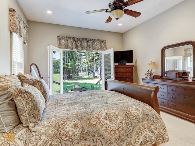 bedroom with ceiling fan, access to exterior, and carpet floors