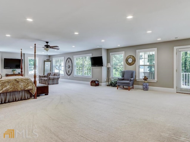 carpeted bedroom with ceiling fan and access to outside