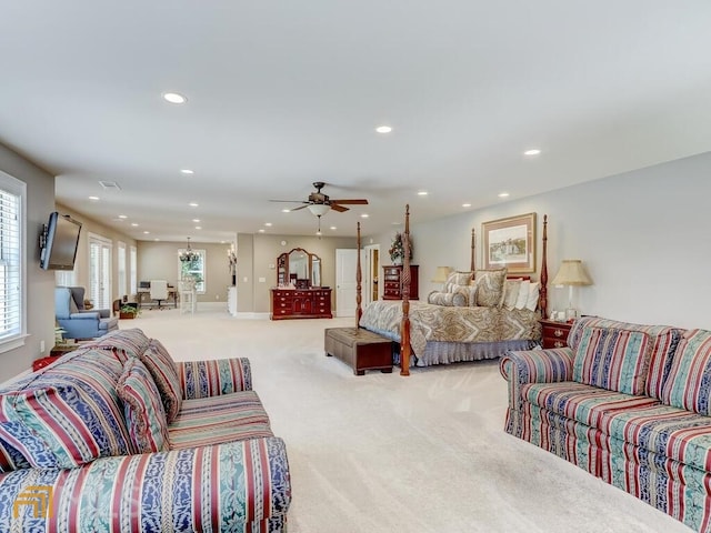 bedroom featuring ceiling fan and light colored carpet