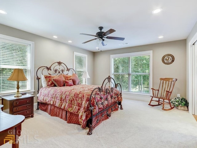 carpeted bedroom featuring ceiling fan