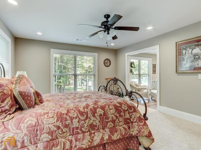 carpeted bedroom featuring ceiling fan