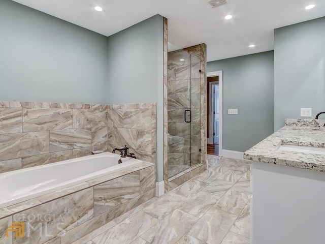 bathroom featuring vanity and plus walk in shower