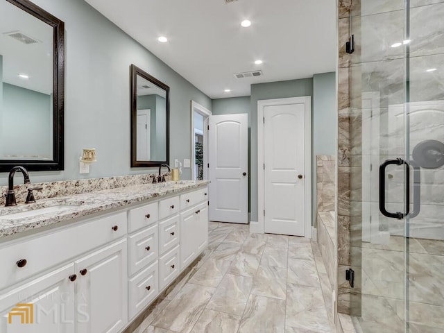 bathroom featuring vanity and walk in shower