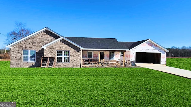 view of front of house featuring a front yard and a garage