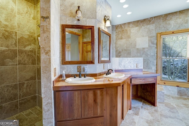 bathroom featuring tile walls and vanity