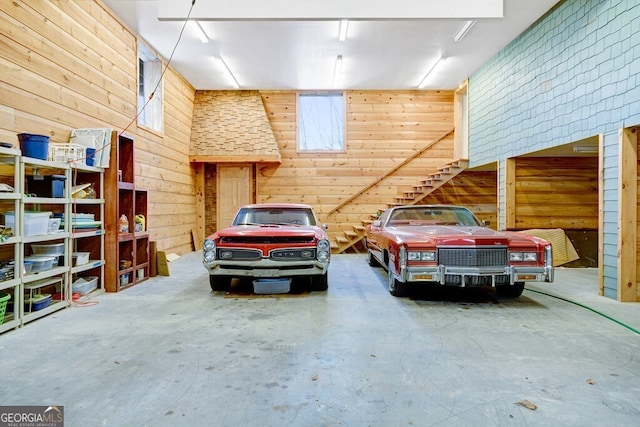 garage featuring wooden walls