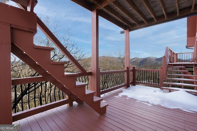 wooden deck with a mountain view