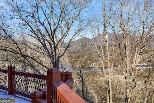 wooden deck with a mountain view