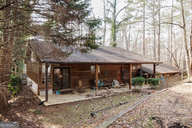 rear view of property featuring a patio