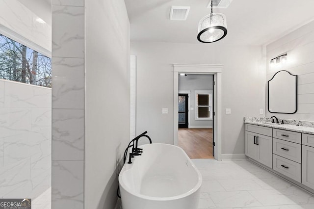 bathroom featuring a bathtub and vanity