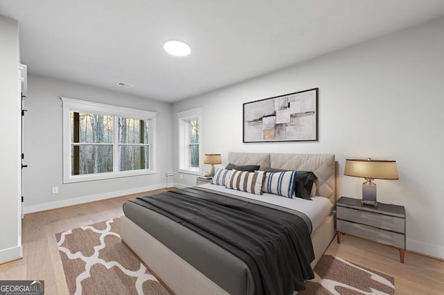 bedroom with light hardwood / wood-style floors