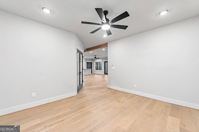 unfurnished room featuring light wood-type flooring and ceiling fan