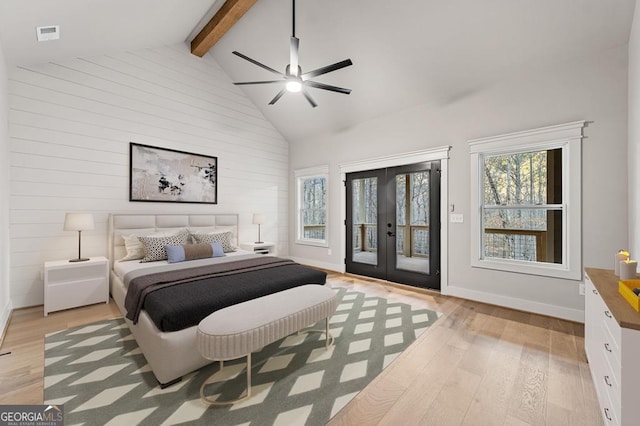 bedroom with light wood-type flooring, ceiling fan, access to exterior, and french doors