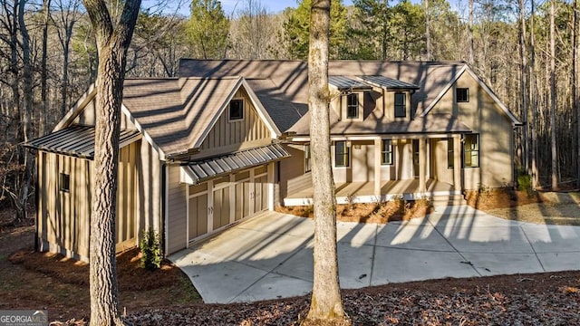 view of front of property featuring a garage and a porch