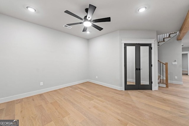 unfurnished room featuring ceiling fan, light hardwood / wood-style floors, and french doors