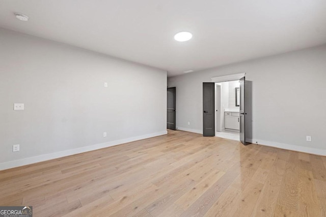 unfurnished bedroom with light wood-type flooring