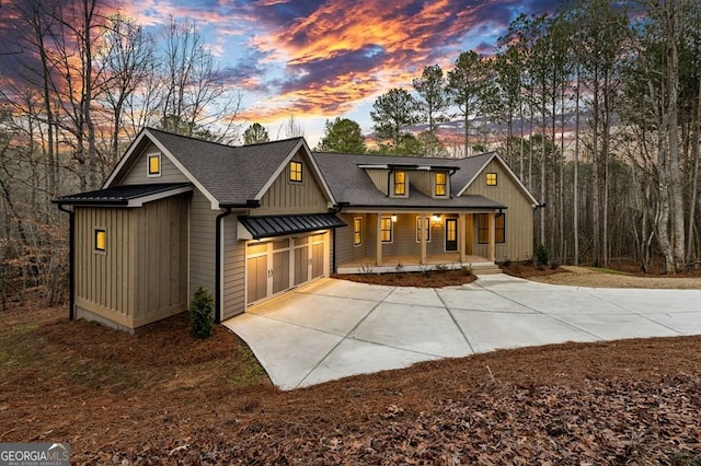 modern farmhouse style home with a garage and a porch