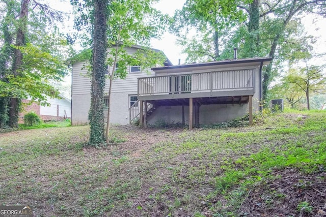 back of house with a wooden deck