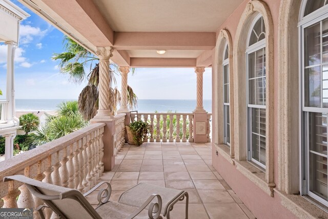balcony featuring a water view