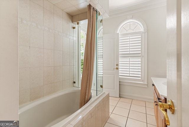 bathroom featuring a healthy amount of sunlight, tile patterned floors, vanity, and shower / tub combo with curtain