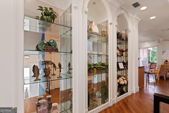 details featuring ceiling fan, wood-type flooring, and crown molding
