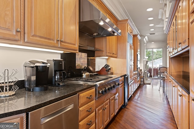 kitchen featuring tasteful backsplash, extractor fan, crown molding, dark wood-type flooring, and appliances with stainless steel finishes