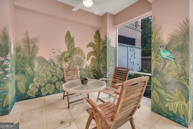 balcony with ceiling fan and a patio area