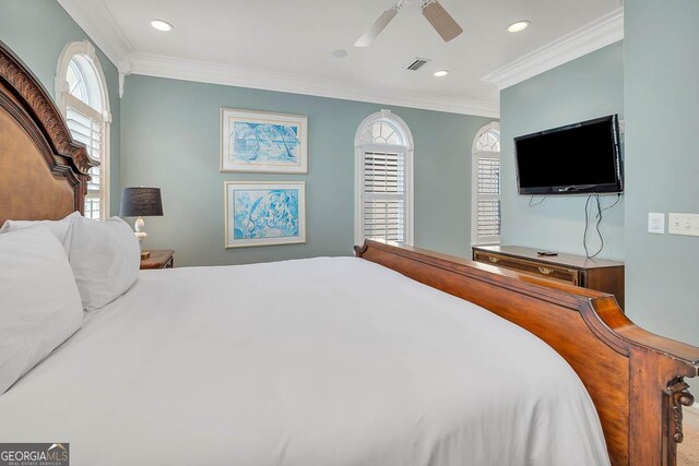 bedroom featuring ceiling fan and ornamental molding