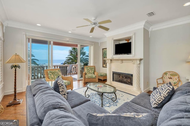 living room featuring light hardwood / wood-style floors and ornamental molding