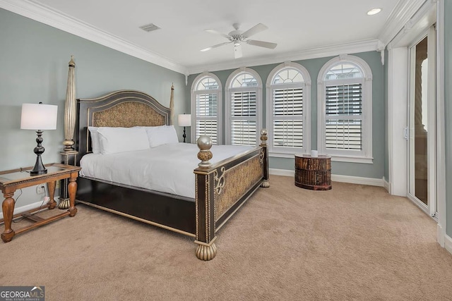 bedroom featuring ceiling fan, light colored carpet, multiple windows, and crown molding